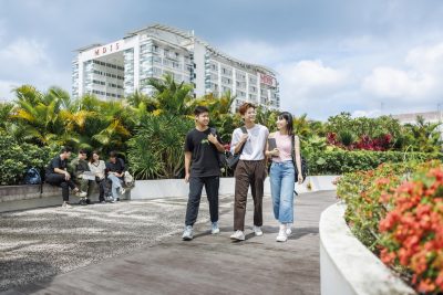 MDIS students walking in the garden on campus.