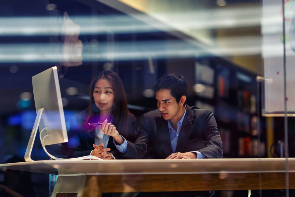 Cybersecurity professionals discussing about software.