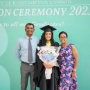 An MDIS graduate posing with her parents for a photo at the MDIS- University of Roehampton London Graduation Ceremony 2023.