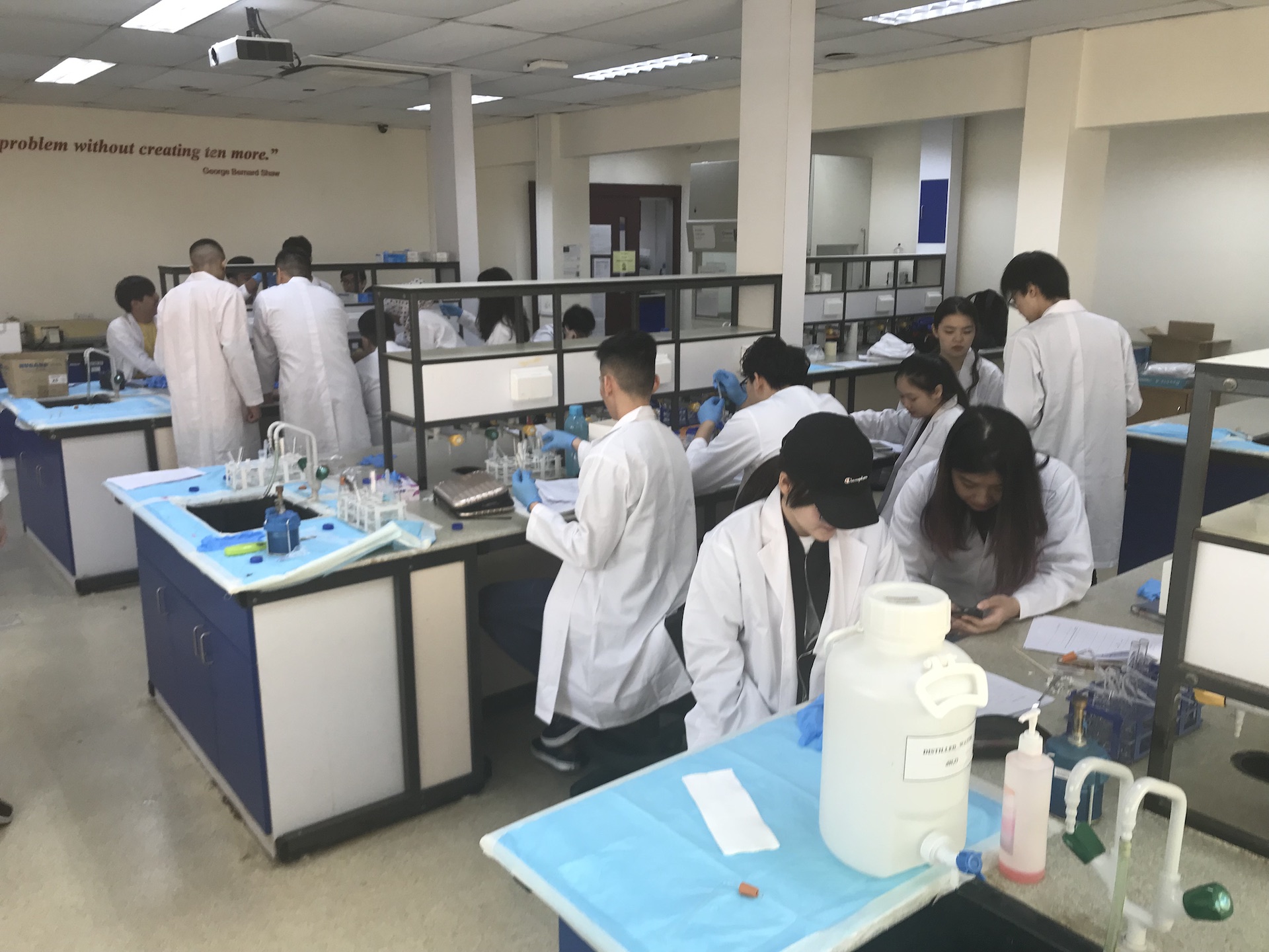 MDIS students working on a mini experiment at the science lab.