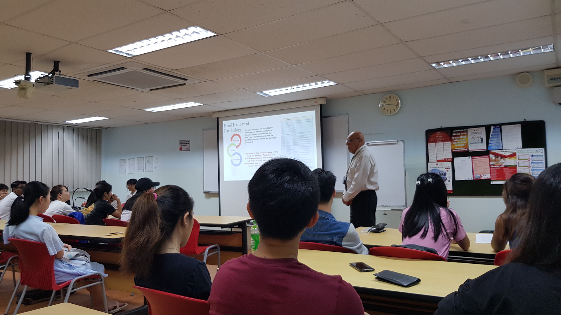 MDIS college lecturer teaching students about psychology.