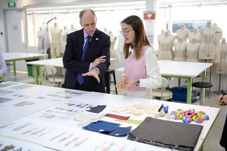 An MDIS student explaining her craft to a working professional.