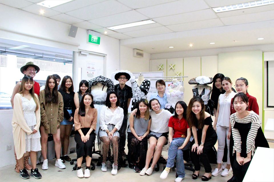 MDIS students posing for a picture in the fashion lab.