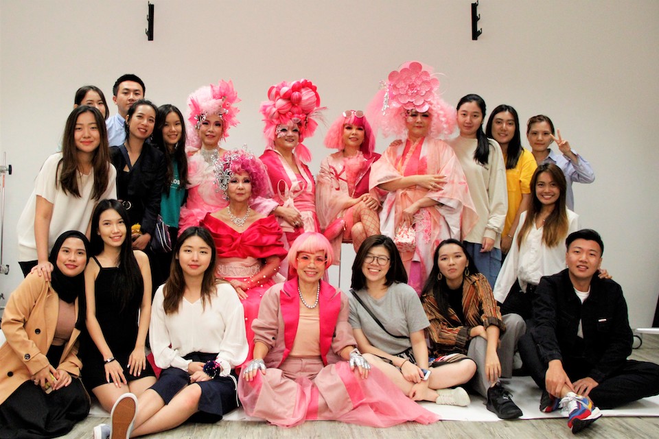 MDIS students and staff posing for a picture at a special event.