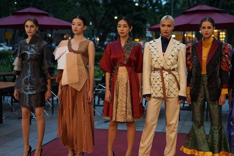 Models showcasing the fashion pieces of MDIS fashion students.