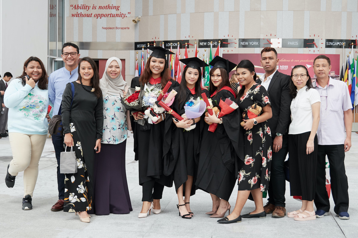 MDIS Nursing graduates pose for a picture.