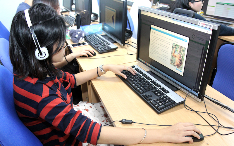 MDIS students in the computer lab accessing learning materials.