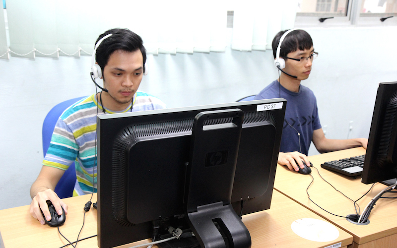 MDIS students using the computer in the classroom for lessons.
