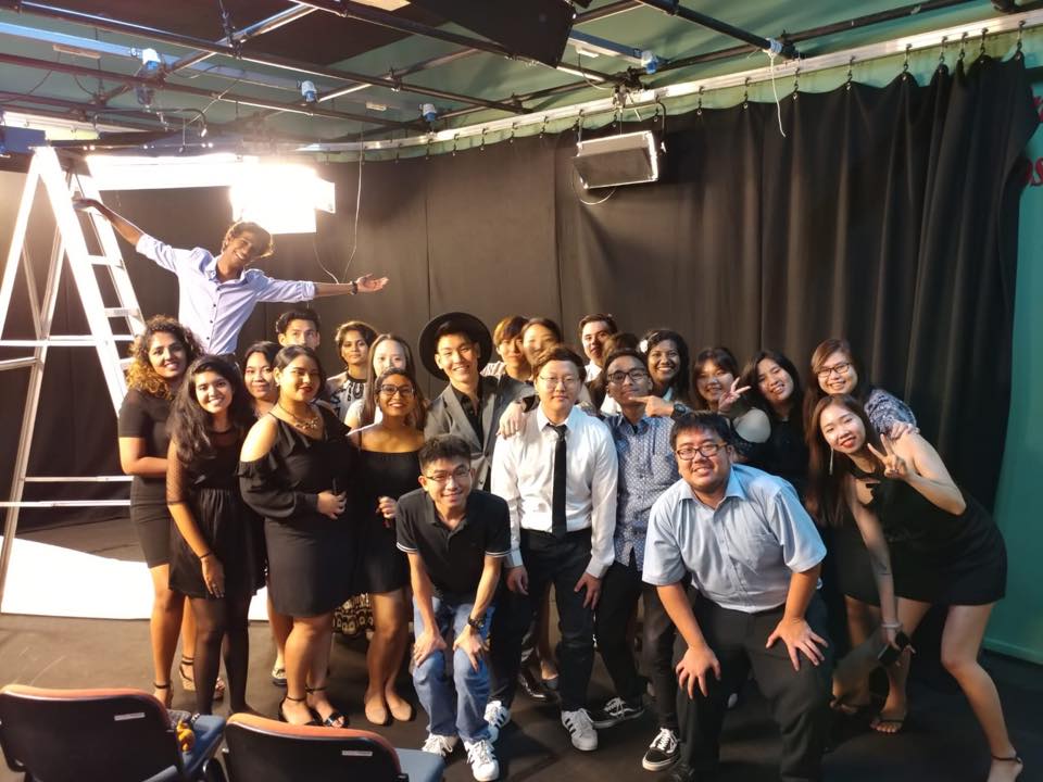 MDIS students posing for a picture in the media lab.