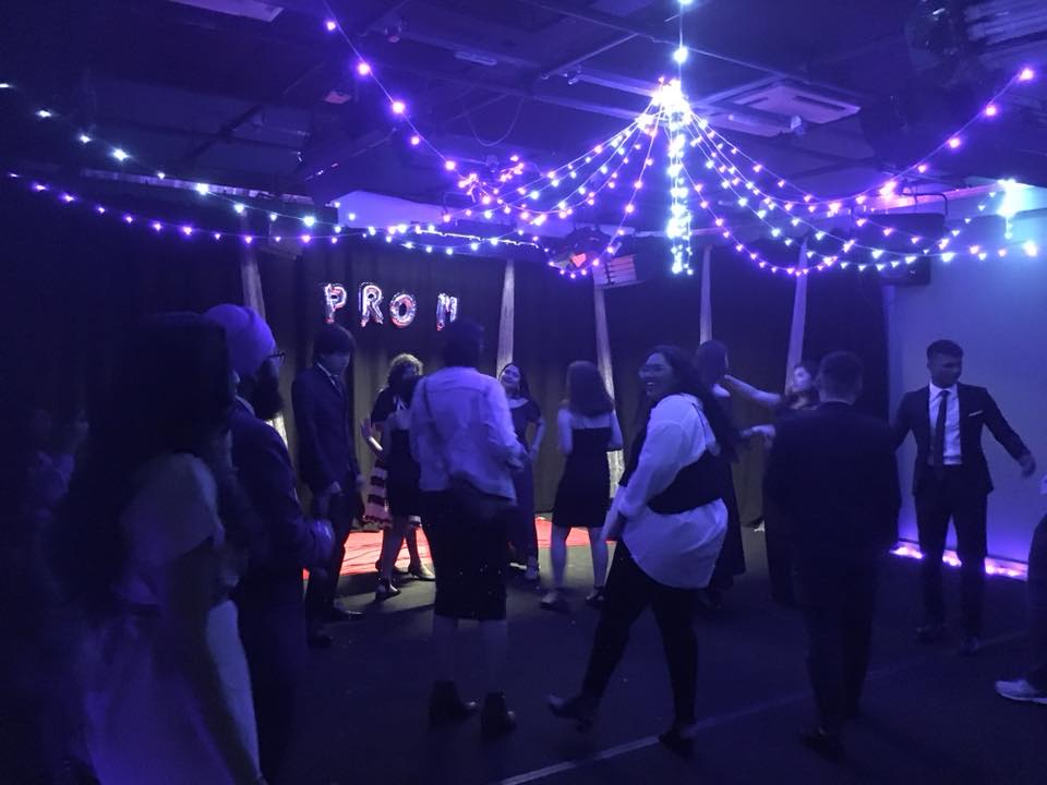 MDIS students dancing and socialising at a prom event.