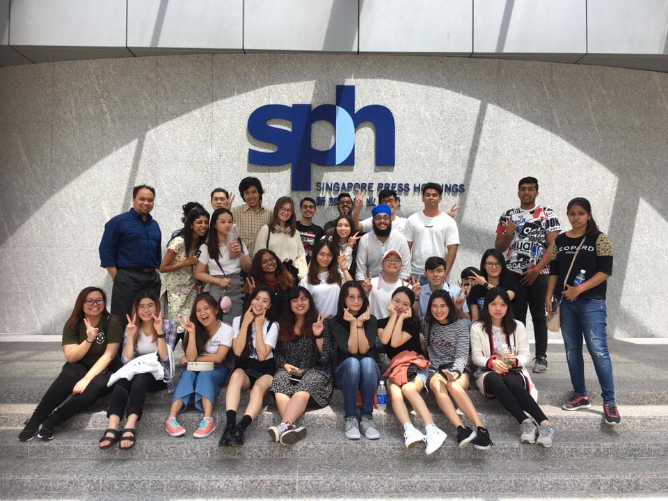 MDIS media students posing for a picture outside the SPH building during a school trip.