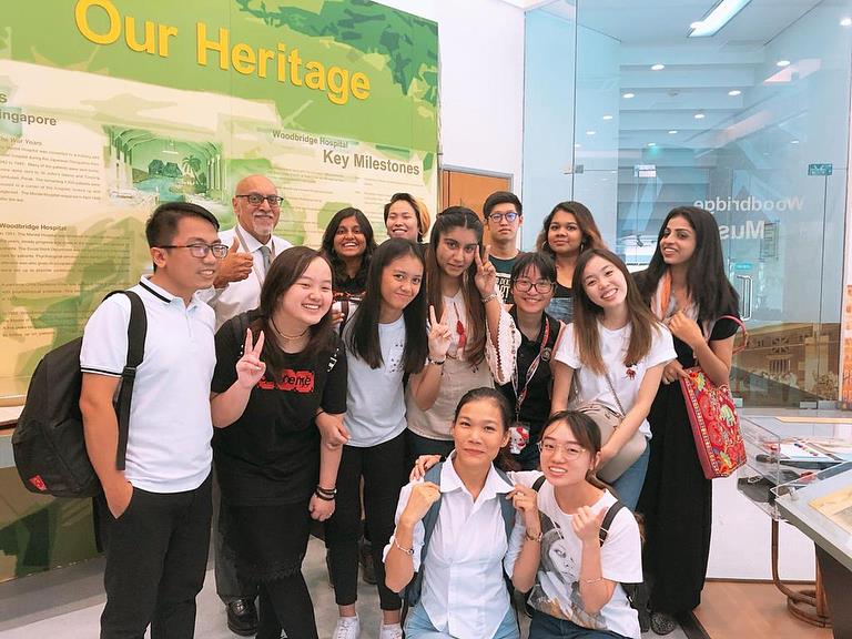 Students posing for a picture while on a school trip.