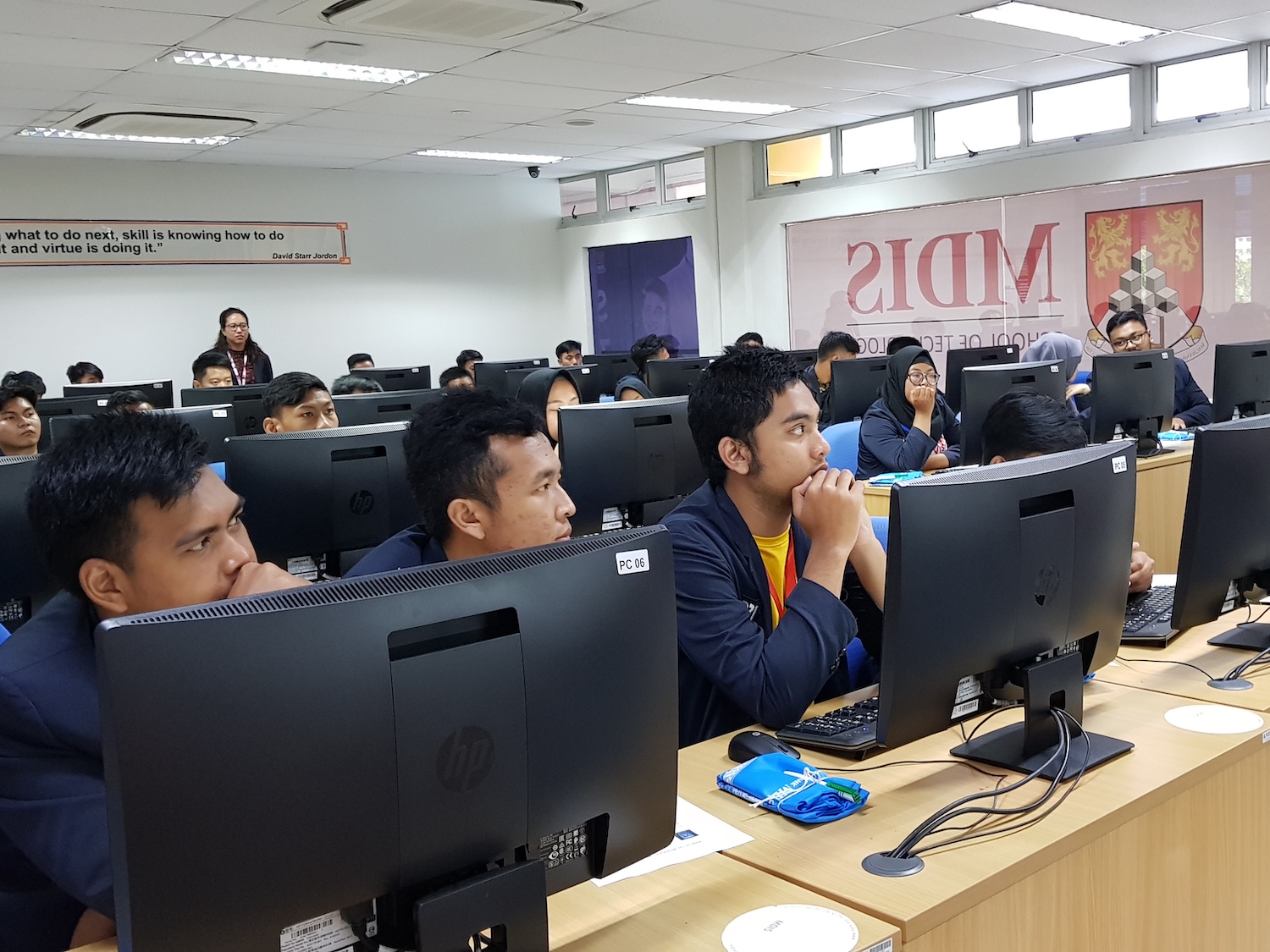 Foreign students listening to MDIS lecturer at the computer lab.