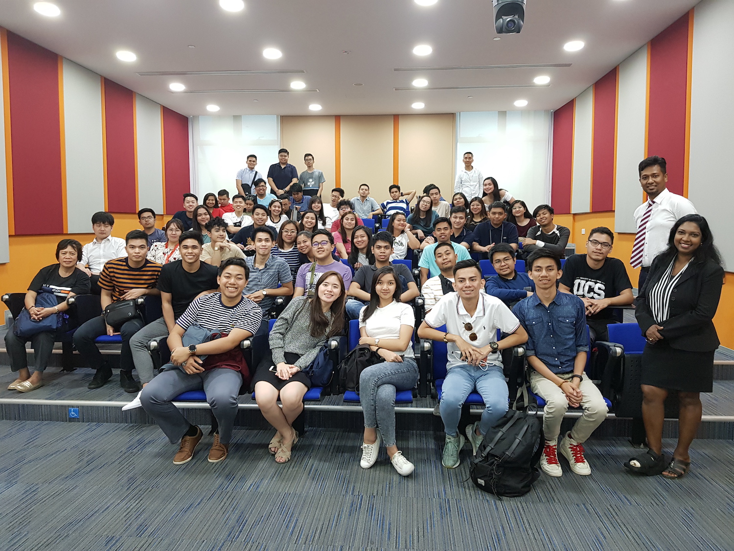 MDIS students posing for a picture in the lecture theatre.
