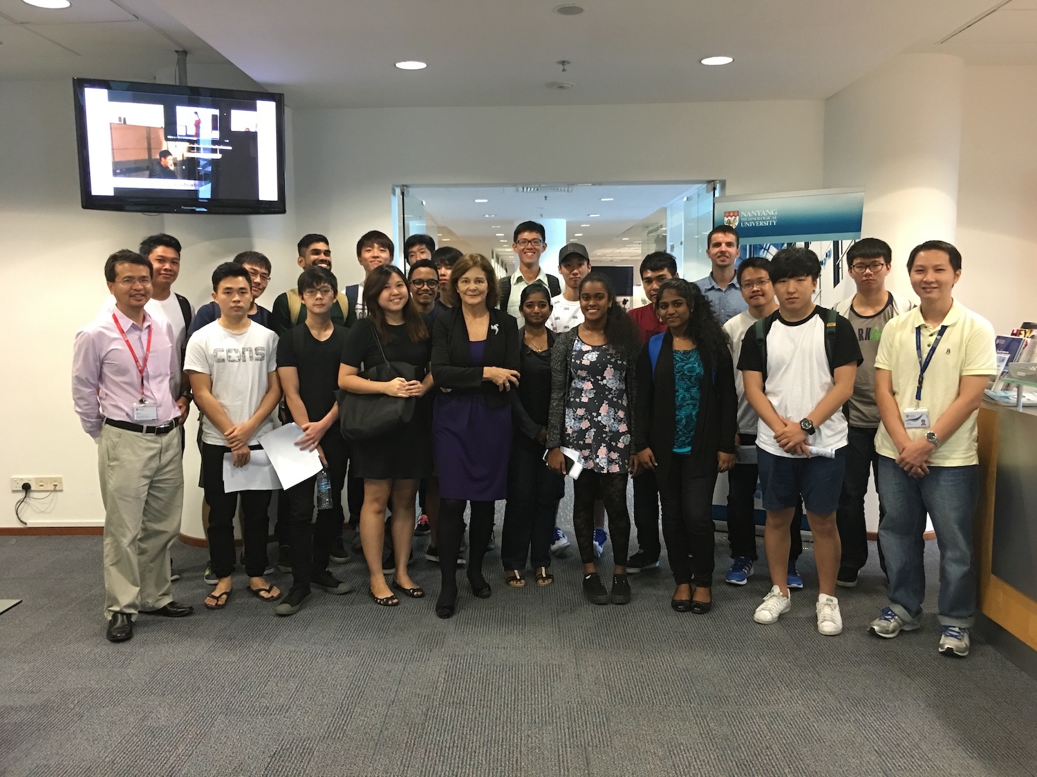 Students pose for a picture with an industry expert.