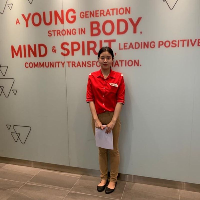 MDIS student posing for a picture during her internship.