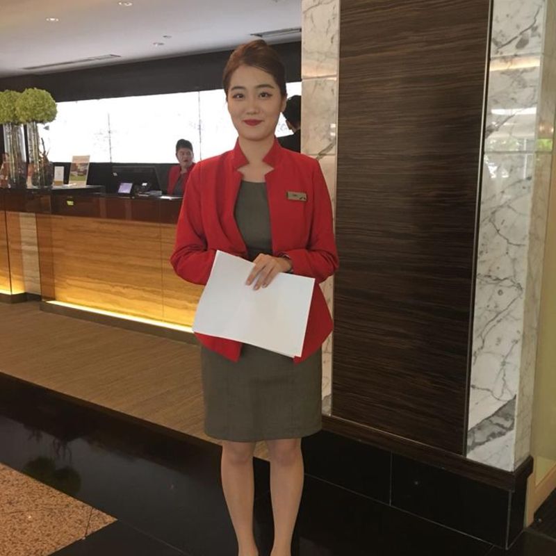 MDIS student poses for a picture during her internship at a hotel.